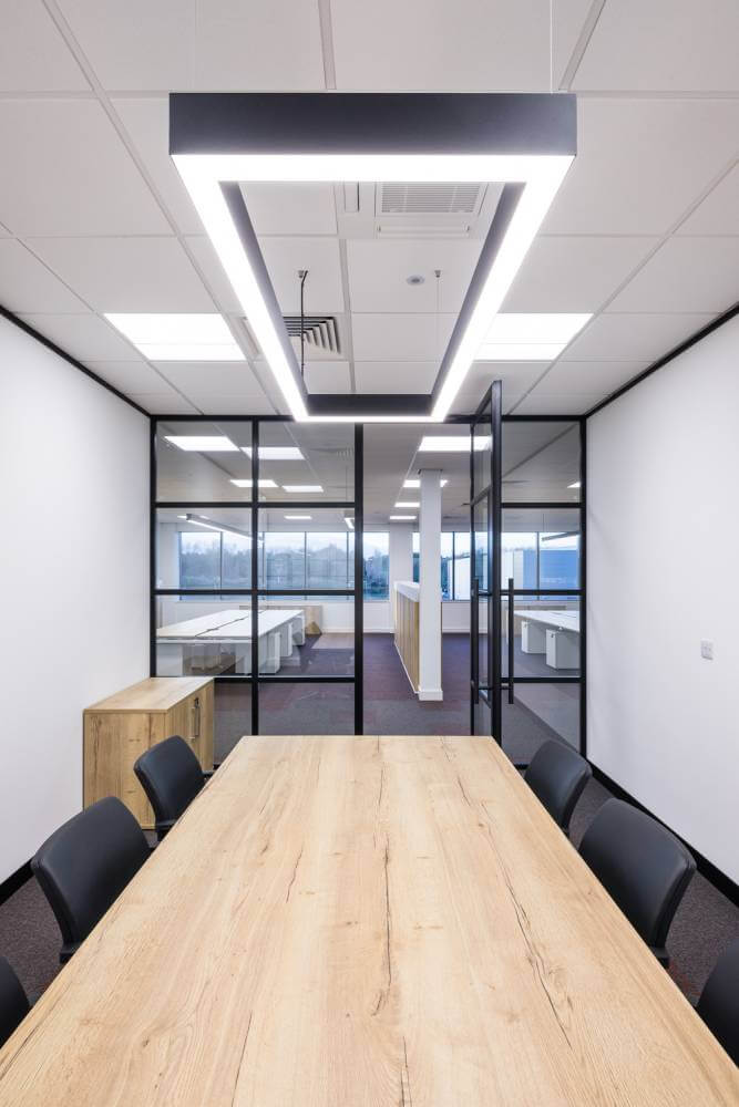 Office meeting room with a conference table in the centre