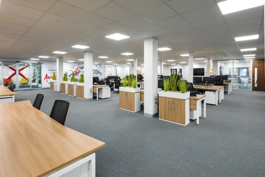 Open-plan office workspace with desks and chairs