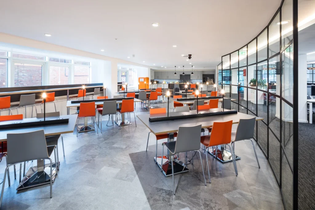 Modern office kitchen area with contemporary furniture designed for business use
